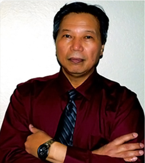 A man in a red shirt and tie